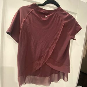 Women’s lululemon top, sightless open back with mesh see through bottom.